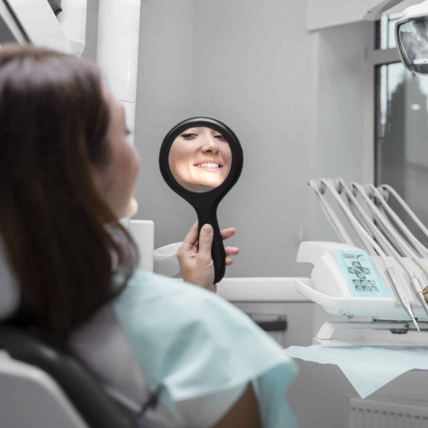 close-up-patient-looking-mirror